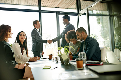 Buy stock photo Business people, meeting and conference with handshake for introduction, greeting or hiring. Group, employees or colleagues shaking hands with new recruit for career or welcome to team in workplace