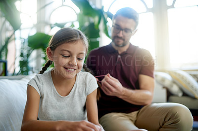 Buy stock photo Hair braid, girl and man in living room with bonding, helping and support for morning routine. Home, daughter and single parent on couch with grooming, together and getting ready for school.