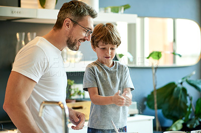 Buy stock photo Baking, bonding and father with kid in kitchen in home with learning, fun and activity together. Connection, flour and dad with boy child for cooking recipe in morning for weekend hobby in house.