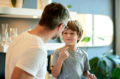 Buy stock photo Baking, father and son in kitchen with flour, bonding together or support for dessert preparation. Happy, parent or child learning with powder ingredients, homemade sweet treats or assistance in home