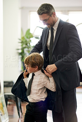 Buy stock photo Suit, clothes and dad with son in home for morning routine, getting dressed and ready for wedding. Family, fashion and father with child for help with tuxedo, blazer and formal outfit for event