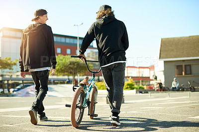 Buy stock photo Friends, back and bicycle for outdoor hobby, activity or challenge in skate park. Bike, people and urban sport for cycling, BMX training and skills for competition with balance and stunt exercise