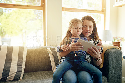 Buy stock photo Tablet, support and mother with child on sofa for education app, streaming service and research. Learning games, ebook subscription and woman with kid in living room of family house for tech