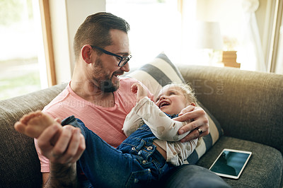 Buy stock photo Smile, relax and father with daughter on sofa for playful games, bonding and love. Happiness, connection and cuddle with man and child in loving room of family home for affection, growth and care