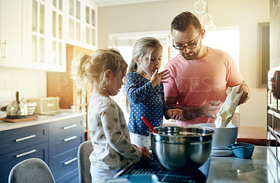 Buy stock photo Baking, home and father with girls, help or bonding together with ingredients. Family, parent or dad in kitchen, daughters or dessert with recipe, mixing bowl or development with utensils or learning