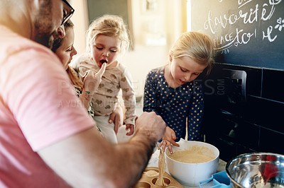 Buy stock photo Baking, home and parents with girls, learning and bonding together with ingredients. Family, mother and father in kitchen, daughters or help with recipe, kids or development with utensils or dessert 