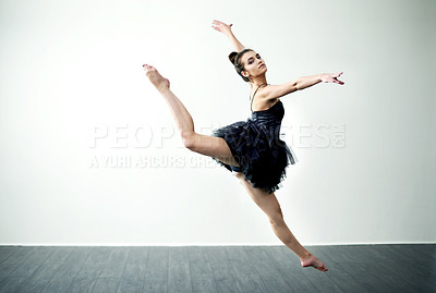 Buy stock photo Dancing, jump or woman in studio for ballet craft, creative performance or grace. Wall space, white background or dancer in recital with elegance, agility or air for skill, body or ballerina academy