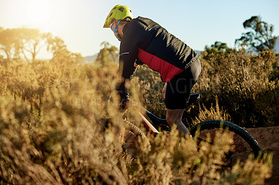 Buy stock photo Mountain biking, off road and sports with man outdoor adrenaline, adventure or training. Exercise, hobby and journey with person cycling in nature for fitness, health challenge or performance