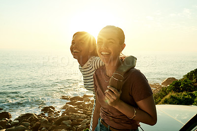 Buy stock photo Portrait, hug and women with car, sea and bonding on road trip, getaway or summer vacation or flare. Tourist, friends and embrace on holiday with vehicle, transport and laugh on weekend or ocean