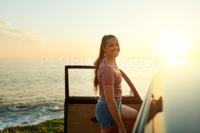 Buy stock photo Sunrise, happy and portrait of woman by car for road trip, adventure and travel destination by ocean. Morning, relax and person by vehicle for holiday, summer vacation and journey by sea outdoor