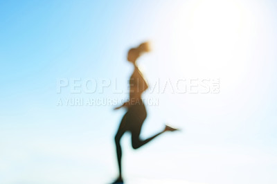 Buy stock photo Blue sky, blur and running with athlete in nature for cardio training, fitness or morning workout. Exercise, flare and space with woman runner outdoor for challenge, improvement or performance