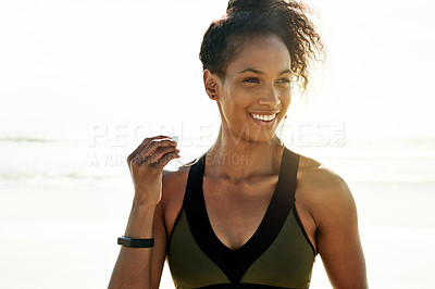 Buy stock photo Earphones, fitness and thinking with woman on beach for start of cardio training or workout in summer. Exercise, flare and planning with happy African runner streaming music outdoor for health