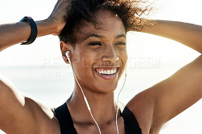 Buy stock photo Thinking, runner and woman with earphones at beach for fitness, listening to music and podcast. Smile, female person and rest with playlist audio for exercise, sports training and marathon practice