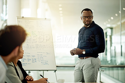 Buy stock photo Boardroom, speaker and man with team, meeting or presentation with whiteboard, group and discussion. Business, presenter and training session for people, sales manager and planning with colleagues