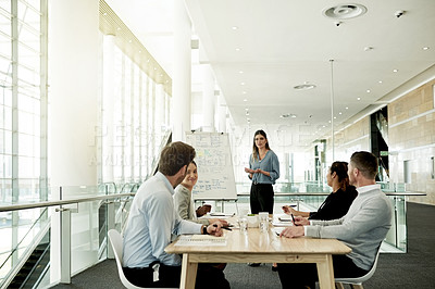 Buy stock photo Business, presentation and woman in office, team and planning for investment deal. Finance agency, people or speaker in workplace, discussion or feedback for profit growth, company mission or meeting