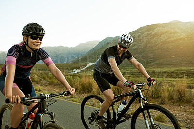 Buy stock photo Smile, cycling and fitness with couple in nature for race team, bike athlete or cardio workout. Triathlon training, exercise and bicycle with man and woman on countryside road for health and travel