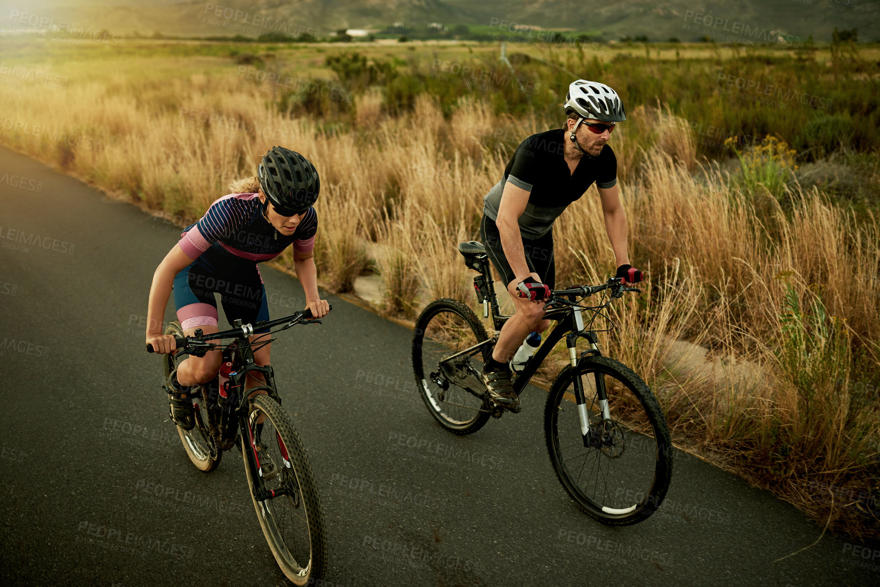 Buy stock photo Cycling, morning and couple with bicycle on mountain for sports hobby, training and outdoor exercise. Workout, fitness and man with woman on bike for adventure, journey and wellness in countryside
