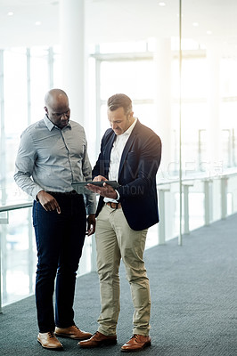 Buy stock photo Office, tablet and business men in lobby in discussion for online proposal, project and financial review. Corporate, meeting and people on digital tech for planning, collaboration and finance report
