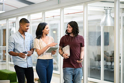 Buy stock photo Walking, business people and tablet with staff in office, planning and online research for startup. Collaboration, employees and digital with tech for information, discuss or prepare for presentation