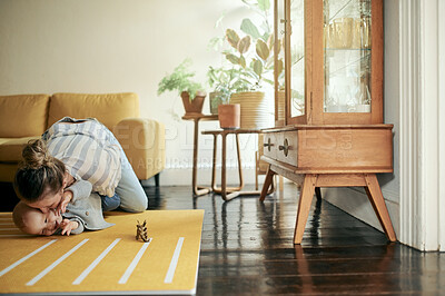 Buy stock photo Family, play and mama kiss baby on floor in home for bonding, quality time and relax together. Living room, love and happy mother with kid playing for child development, care and happiness on weekend