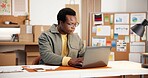 Black man, laptop and reading in small business for logistics, order management and feedback. Entrepreneur, serious and PC in office for inventory control, website update and planning distribution