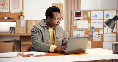 Buy stock photo Black man, laptop and reading in small business for logistics, order management and feedback. Entrepreneur, serious and PC in office for inventory control, website update and planning distribution