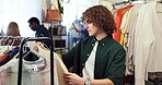 Shopping, option or man in store with clothing rack, outfit planning or decision in trendy style. Retail, search or customer in boutique with apparel, garment choice or selection in fashion purchase.