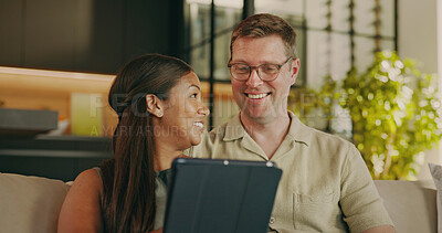 Buy stock photo Relax, love and tablet with interracial couple on sofa for streaming service, bonding and smile. Film subscription, connection and happy with man and woman in living room in home for media app