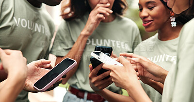 Buy stock photo Phone, hands and group outdoor with volunteer shift calendar, team chat or online event coordination. People, NGO or mobile in circle for digital charity roster, check donation website or share info