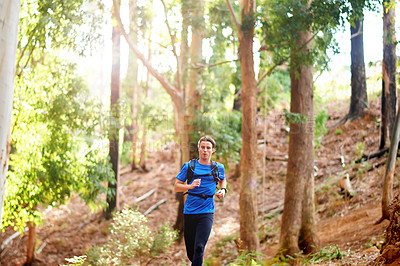 Buy stock photo Running, fitness and man in nature for workout, marathon training and cardio exercise. Sports, forest and athlete in woods for wellness, healthy body and endurance for race, challenge and competition