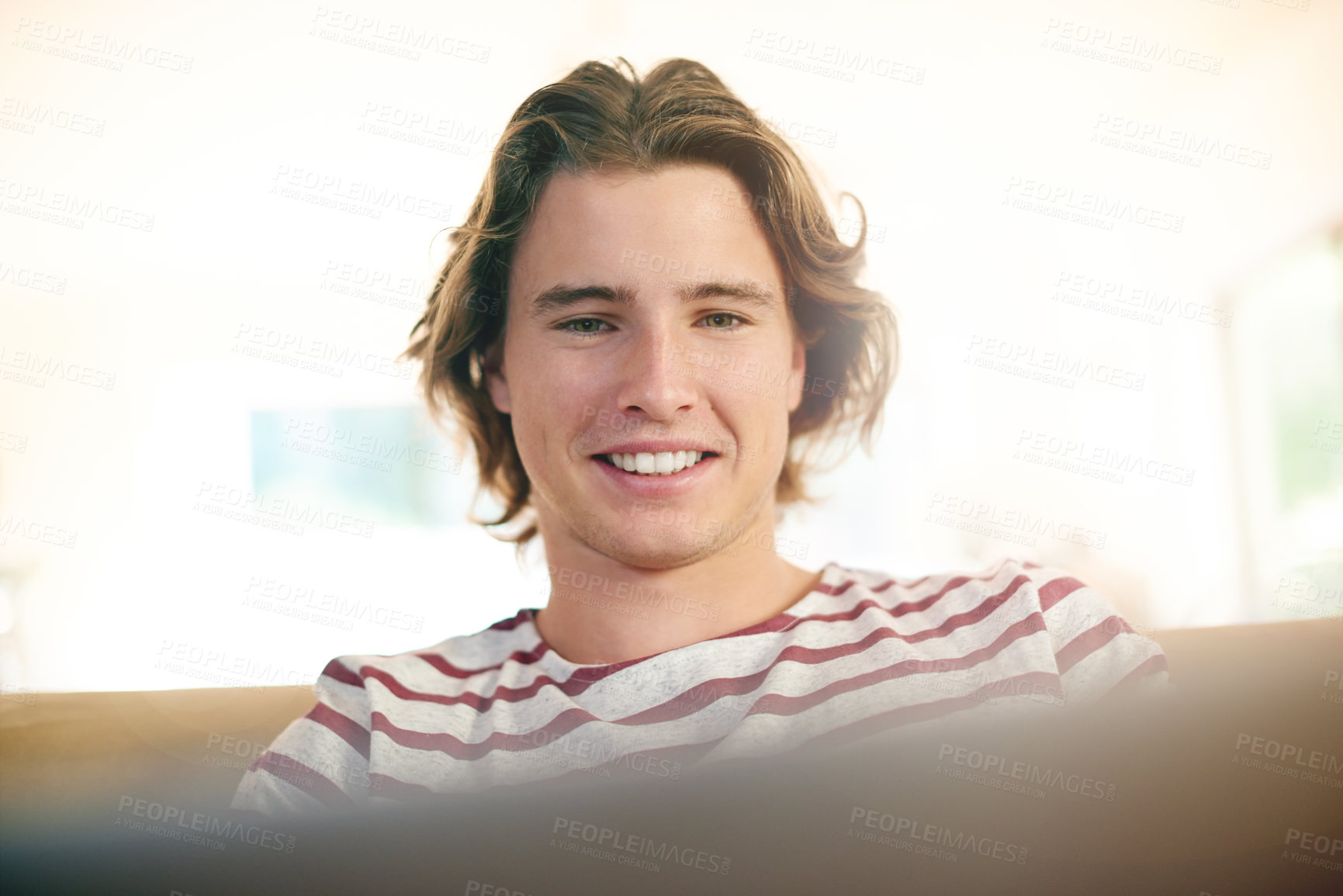 Buy stock photo Laptop, smile and man on sofa for email, reading and university scholarship application in home. Tech, research and male student in living room for college admission test, exam or study assignment