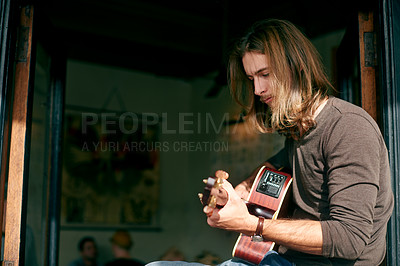 Buy stock photo Man, guitar and song at coffee shop with music, performance and play in window with talent. Person, musician or artist with string instrument, sound and rhythm for creativity with concert at cafe