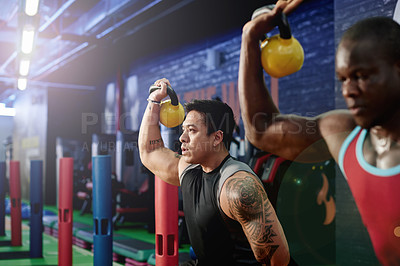 Buy stock photo Gym, people and kettlebell fitness for exercise, power and sports challenge for muscle. Group, bodybuilder and heavy weights for training with health club, workout class and personal trainer athlete
