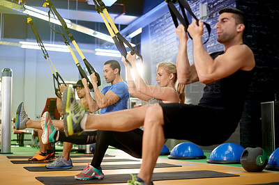 Buy stock photo Resistance band, exercise and people in class in gym for fitness, cardio workout and training in studio. Sports equipment, health club and men with personal trainer for wellness, strength and muscles