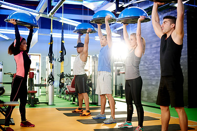 Buy stock photo Balance ball, fitness and people in gym for exercise, cardio workout and training for mobility. Sports, personal trainer and group with equipment for wellness, stretching and muscle strength in class