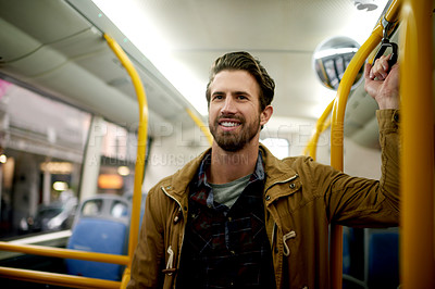 Buy stock photo Travel, journey and man in train, smile and commuting in morning to work, confident and public transport. Happy, passenger and trip for person in vehicle, standing and employee with pride for routine