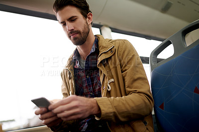 Buy stock photo Bus, travel and man with smartphone, connection and communication with morning commute. Person, traveller and passenger with cellphone, mobile user and texting with social media or message to contact