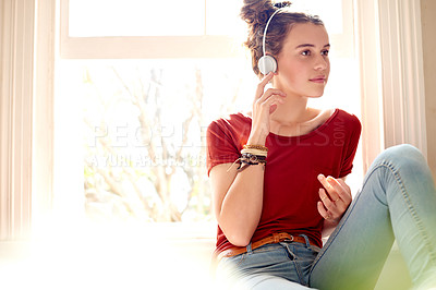 Buy stock photo Happy, relax and girl with headphones in home for listening to music, playlist and radio. Morning, window and teenager in house for streaming audio, song and podcast for entertainment on weekend
