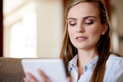 Buy stock photo Home, relax and woman on sofa, tablet and online reading with entertainment, social media and email. Apartment, tech and person on couch, digital app and message to contact, chatting or communication