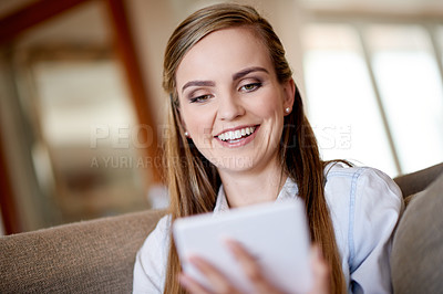 Buy stock photo Home, smile and woman on sofa, tablet and online reading with entertainment, network and email. Happy, technology and person on couch, digital app and message to contact, chatting or subscription