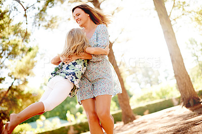 Buy stock photo Happy, mother and spinning child at park for fun, playful games and bonding together on holiday. Smile, woman and swinging kid with energy, activity and coordination with balance for vacation outdoor