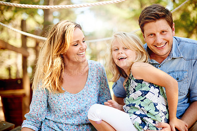 Buy stock photo Happy, nature and parents with child in park for bonding, care and family time on holiday. Smile, love and portrait of girl kid with mom and dad for playing together outdoor in garden on weekend.