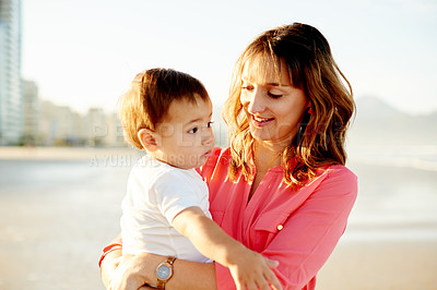 Buy stock photo Smile, family and mother with child at beach for bonding, relationship and relax in nature. Ocean, travel and parent with boy for holiday, vacation and weekend for support and adventure on trip