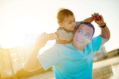 Buy stock photo Flare, father and toddler with shoulder carry outdoor, family vacation and smile with bonding in nature. Single parent, man and boy with freedom, fun and happy sunset at beach with holiday abroad