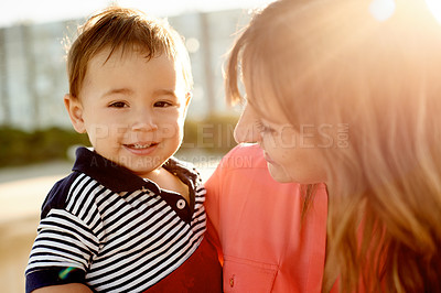 Buy stock photo Portrait, child and bonding with mom, outdoor or woman on holiday with son, love or family on break. Happy, parent and care for toddler on vacation, flare and together on weekend, smile and affection