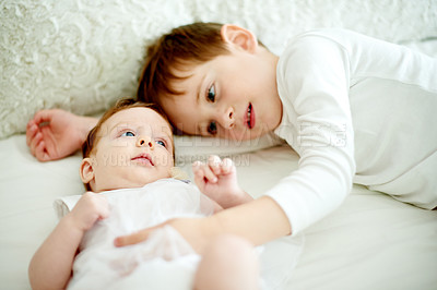 Buy stock photo Baby, bonding or cuddle with boy in bedroom of home with sibling for development or growth. Family, love or morning with brother and infant sister on bed in apartment together for safety or security