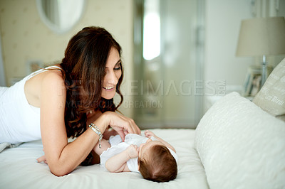 Buy stock photo Bed, cuddle or development with baby and mother in home together for bonding, growth or love. Relax, security and smile of woman parent with infant child in bedroom of apartment for connection