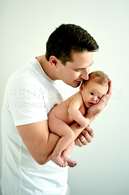 Buy stock photo Love, holding and dad with baby in home for healthy relationship, bonding and support. Family, white background and newborn with man together for connection, affection and trust for parenting