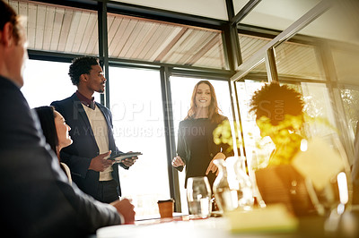 Buy stock photo Presentation, meeting and speakers with business people in office for finance review, feedback and strategy. Flare, corporate and worker on tablet for financial report, discussion and proposal