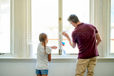 Buy stock photo Parent, child and cleaning window with spray for learning, germs or bacteria prevention. Back of man, dad and teaching girl to wipe surface with cloth for help, housework and chores or responsibility